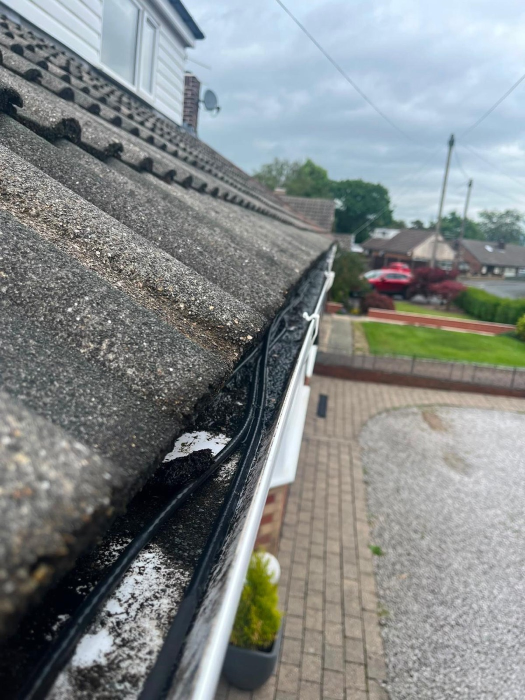 Gutter cleaning in Rishton - before